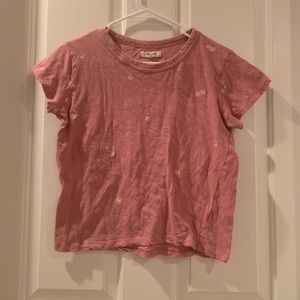 Pink shirt with sewn white and yellow flowers